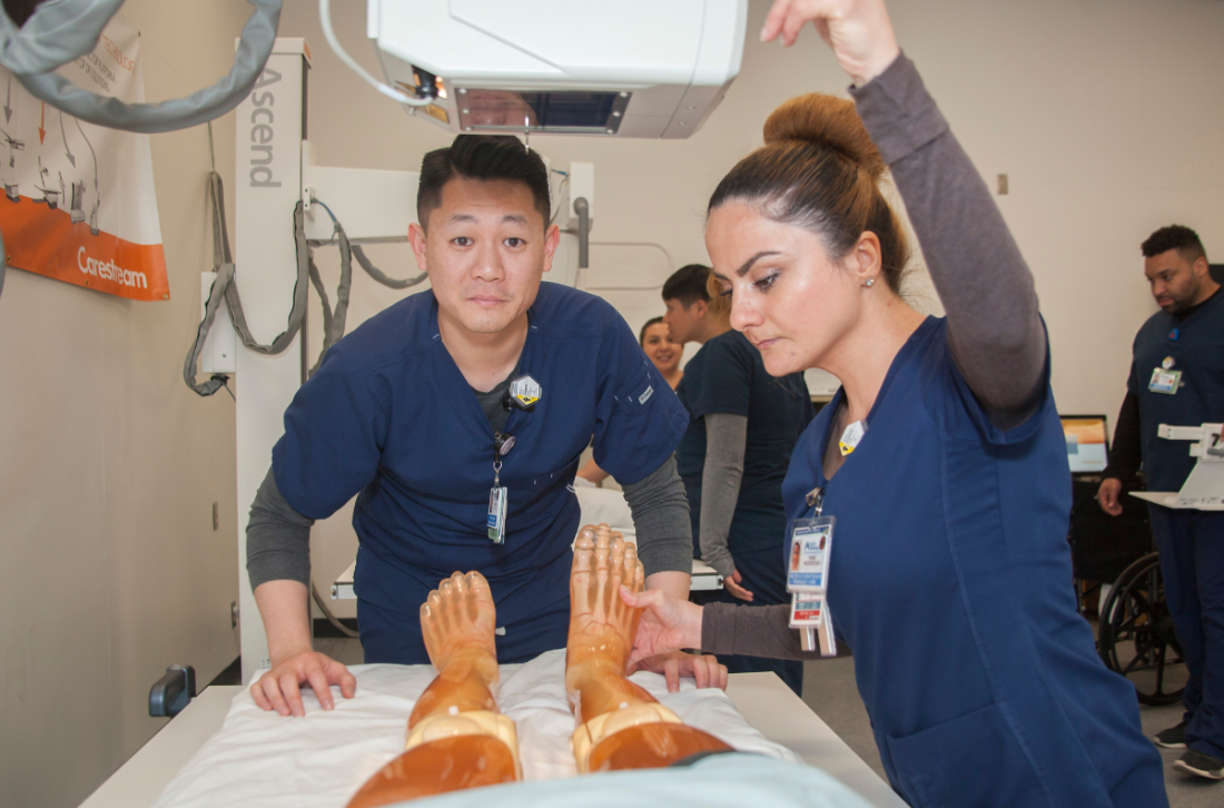 Rad Tech students practicing with an xray machine